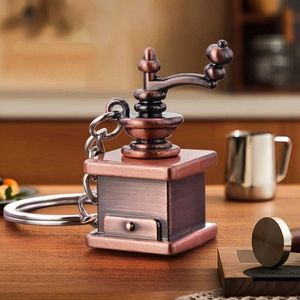 3D vintage coffee grinder keychain in red bronze finish with high-quality metal texture