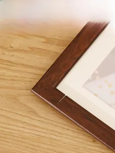 Detail of dark brown wooden frame with natural grain, 2cm width and 1.2cm thickness