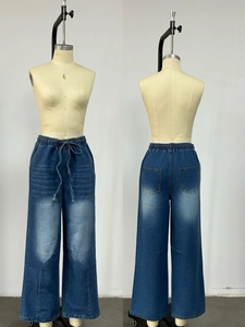 Front and back view of washed blue wide-leg jeans with drawstring waist and pockets