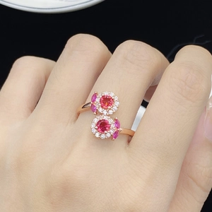 Rose gold adjustable ring featuring dual pink rubies with sparkling diamond halo