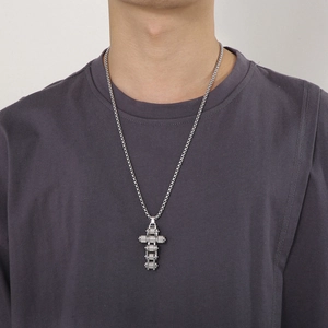 Silver bicycle chain cross pendant necklace on male model with square pearl titanium chain