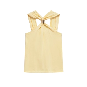 Close-up of yellow knit top featuring twist halter neck with gold metal ring detail