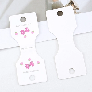 White T-shaped cardboard display cards with strawberry bow patterns for hair accessories