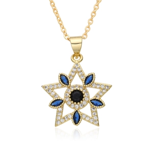Macro detail of star pendant with black center gem and blue marquise stones