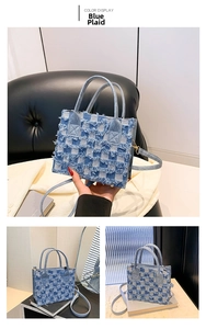 Close-up of blue checkerboard denim handbag with distressed edges and detachable strap