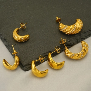 Golden crescent moon stud earrings set with polished finish and sparkling star zircons
