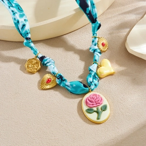 Blue tie-dye silk scarf necklace with gold heart and floral enamel oval pendant