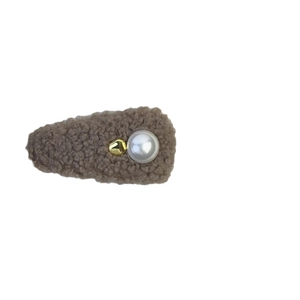 Brown faux shearling pearl hair clip with gold bead on a clean white background