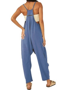 Detailed back view of blue sleeveless jumpsuit with zipper pocket and spaghetti straps