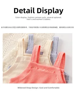 Close-up of ribbed cotton baby bodysuits with wide straps in pink, yellow, and grey