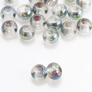 Macro shot of 8x10mm transparent glass beads with rainbow iridescent coating for DIY jewelry