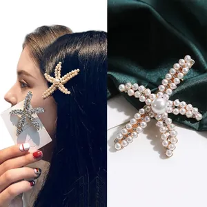 Elegant starfish hair clip with pearls and rhinestones on a metal base for women