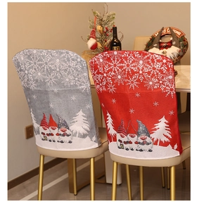 Detailed view of red and grey knitted Christmas gnome chair covers in a cozy dining room