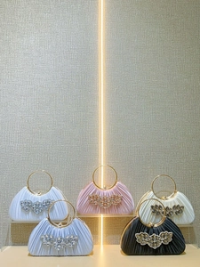 Elegant satin tote bags with crystal embellishments and golden metal ring handles
