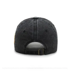 Rear view of washed black denim baseball cap featuring adjustable bronze metal buckle