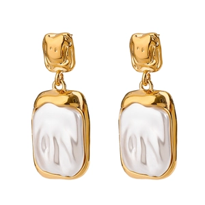 Elegant gold titanium steel stud earrings with rectangular baroque pearls on white background