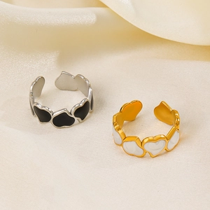 Adjustable heart rings in gold and silver finish with black and white enamel details