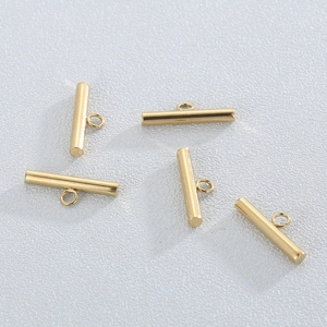 Polished gold stainless steel OT toggle clasps for jewelry making displayed on grey background