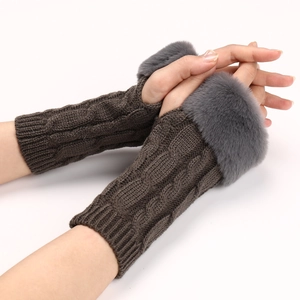 Close-up of twist knit texture and plush faux fur trim on winter half-finger gloves