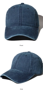 Detail view of washed navy blue cotton baseball cap showing front and side perspectives