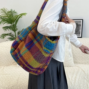Close-up of colorful checkered faux fur tote bag showing soft texture and large capacity