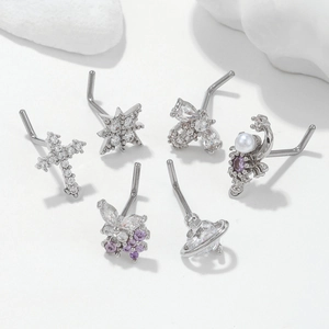 Set of 6 silver L-shaped nose studs with zirconia butterfly, star and planet designs