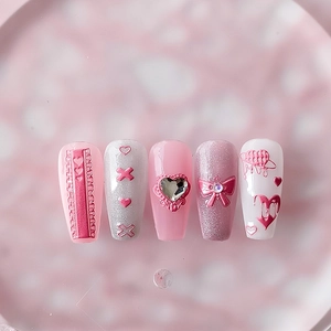 3D pink press-on nails with bow, heart rhinestone and silver glitter butterfly details