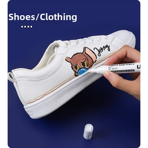 DIY custom painting on white shoes using a waterproof white permanent paint marker