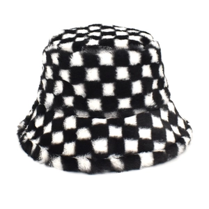 Detail of black and white checkerboard plush bucket hat with fuzzy faux fur texture