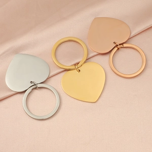 Polished heart-shaped stainless steel keychains in silver, gold, and rose gold finishes