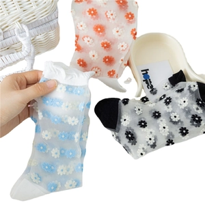 Three pairs of transparent summer floral socks in white, blue and black with lace trim