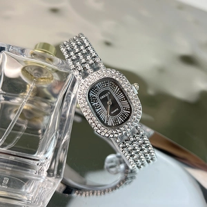 Elegant silver women's quartz watch with oval diamond-set case and black Roman dial