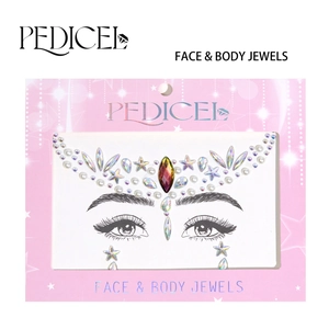 Detailed view of iridescent face and body jewels set with stars and pearls on display card