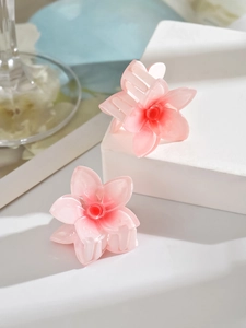Detail of translucent pink gradient flower hair claw clip with strong metal spring