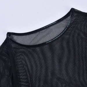 Close-up of the black sheer mesh fabric and neckline detail on the long-sleeve top