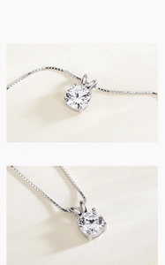 Macro detail of S925 sterling silver necklace with a 1-carat round sparkling zircon pendant