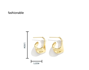 Detail of gold C-shape wavy earrings showing irregular texture and 1.9cm height dimensions
