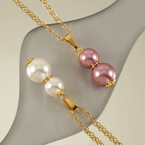 Gourd-shaped pearl pendant necklace with white and pink pearls on a gold-plated titanium chain