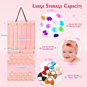 Pink felt jewelry organizer detail with hooks and bars for bows and headbands