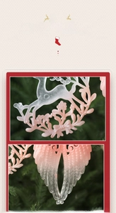 Close-up of pink and white elk and angel wing Christmas ornaments with textured details