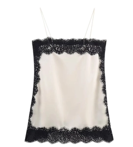 Detailed close-up of lace-trimmed satin camisole top featuring contrast stitching