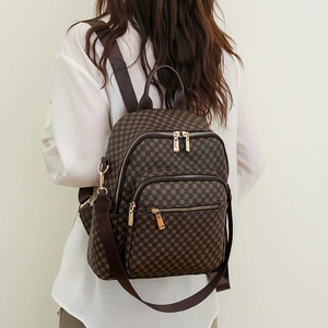 Brown vintage checkered large capacity waterproof backpack with adjustable straps on model