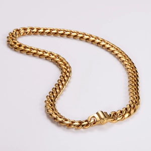 Polished gold stainless steel Cuban link chain necklace with secure clasp on white background