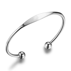 Polished stainless steel C-shaped open cuff bracelet with flat center for custom engraving