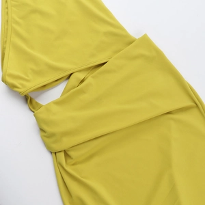 Close-up of mustard yellow high-elasticity fabric on an elegant bodycon dress