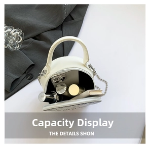 Internal capacity of the round white leather crossbody bag with chain strap