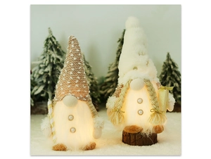 Dettaglio di gnomi di Natale luminosi con bastoncino di zucchero e scatola regalo