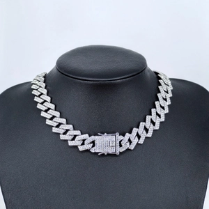 Silver cuban link necklace with full rhinestones shown on a black display bust
