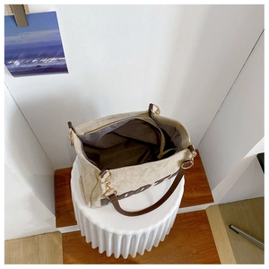 Top view of large canvas tote bag showing spacious interior compartment and leather handles