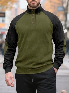 Close-up of olive green corduroy texture and button placket on men's raglan sweater